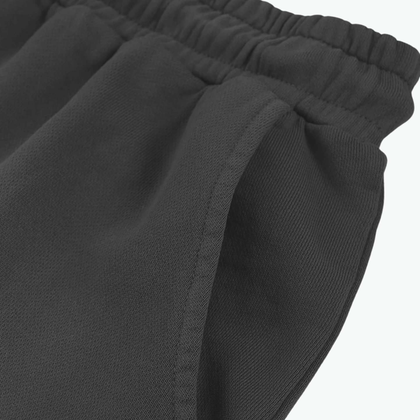 Close-up of the waistband and fabric of the Kalispera ORIGIN shorts in dark gray, showcasing comfort and quality.