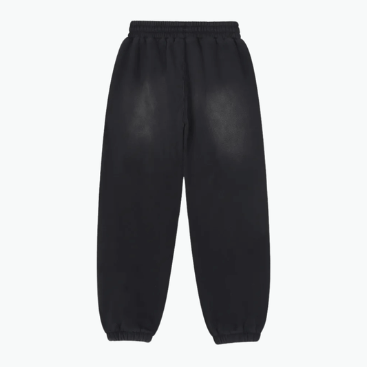 Black sweatpants with elastic waistband, featuring a relaxed fit from the ORIGIN collection by Kalispera.