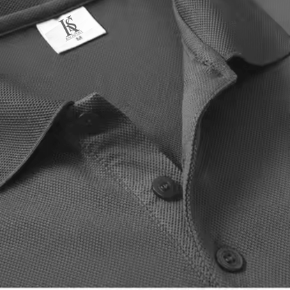 Close-up of textured gray polo shirt collar with Kalispera logo label and buttons, embodying urban chic style.