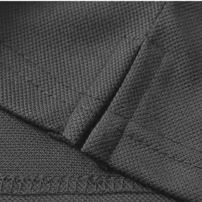 Close-up of the high-quality fabric and stitching of the Kalispera ORIGIN polo in black.