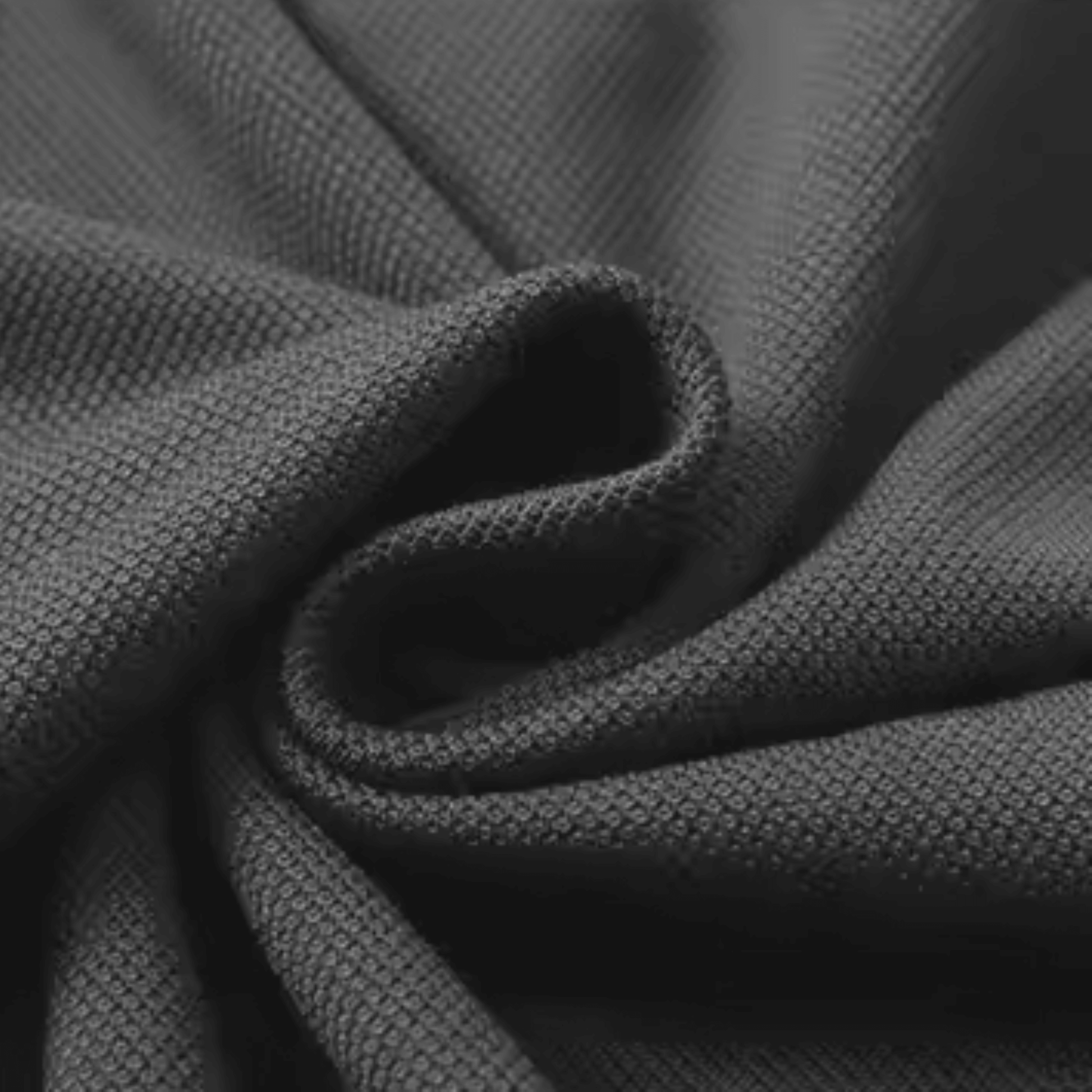 Close-up of high-quality polyester-cotton blend fabric showcasing its texture and durability.
